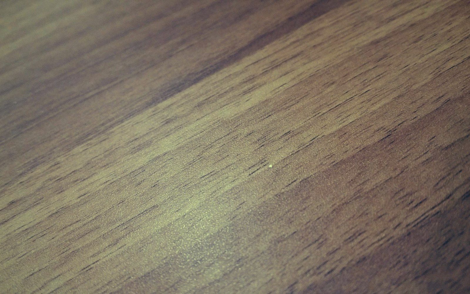 Close-up of a wooden surface showing diagonal grain lines and natural texture