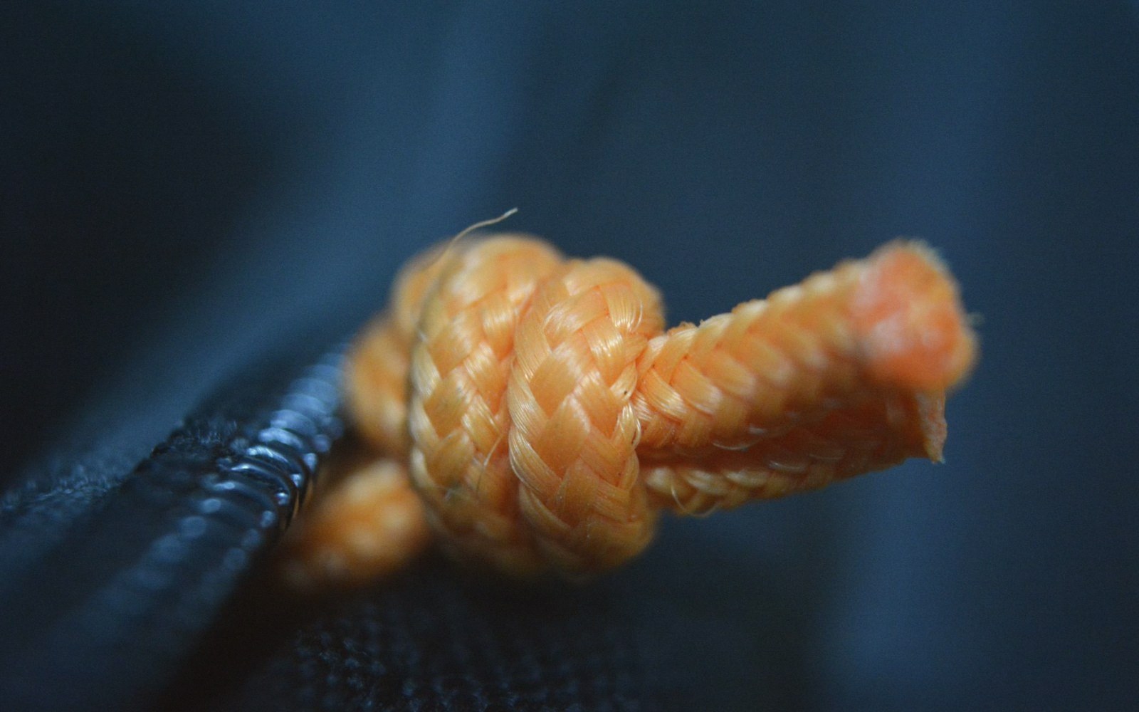 Macro of the leather tip cap and cord tension
